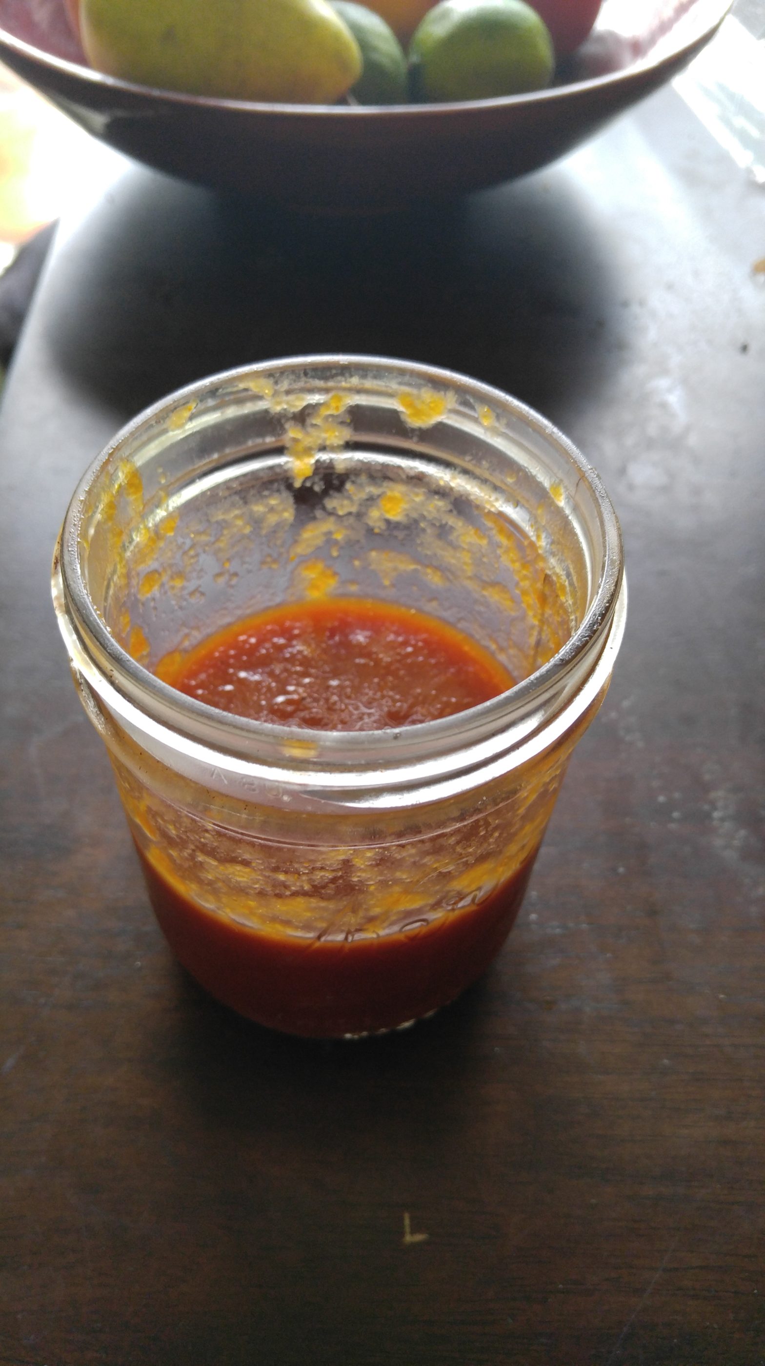 mason jar half-full of barbecue sauce
